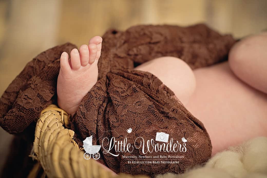 kingwood baby pictures- baby foot in brown lace